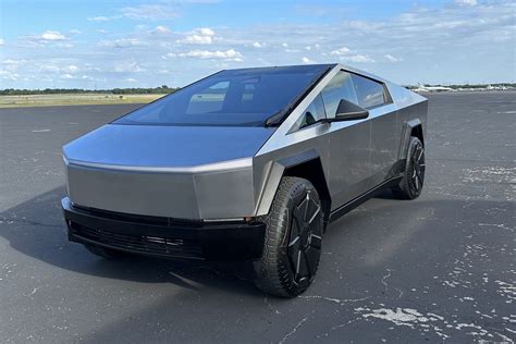 box looking electric car|Tesla Cybertruck images, polished electric car by Elon .